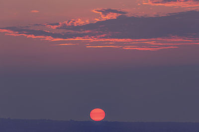 Scenic view of silhouette landscape against romantic sky at sunset