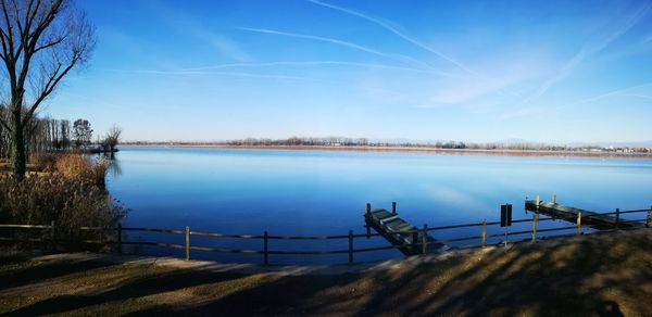 Scenic view of lake against blue sky