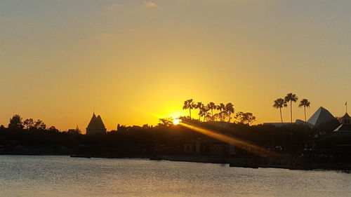 Silhouette temple against sky during sunset