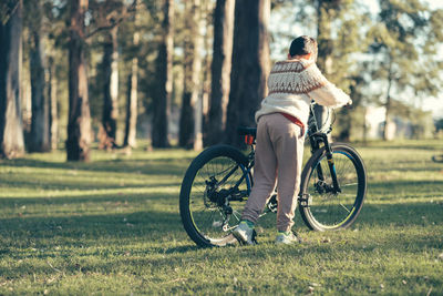 Portrait of child about to ride bicycle