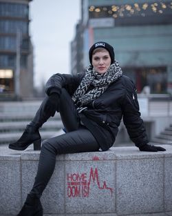 Woman sitting in snow