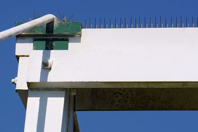 Low angle view of building against clear blue sky