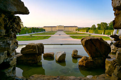 Panoramic view of rocks and river against sky