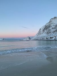 Scenic view of sea against sky during winter