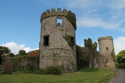 Old ruin building against blue sky