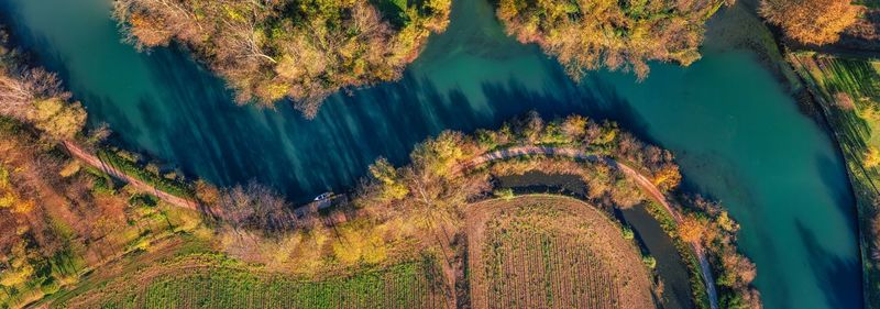 Aerial view of the sile river at s. elena di silea, treviso, italy, at sunrise in autumn