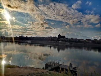 Scenic view of lake against sky during sunset