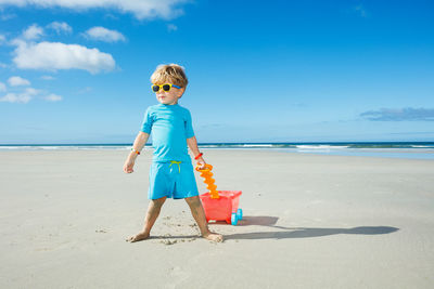 Portrait of girl standing at beach