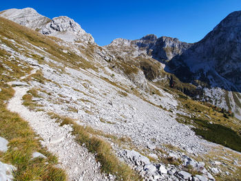 Scenic view of snowcapped mountains against clear sky