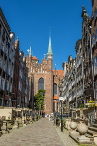 Low angle view of buildings against blue sky