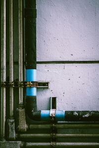 Close-up of pipes against wall