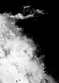 Close-up of splashing water against black background