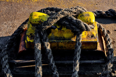 Close-up of rope tied to rusty metal
