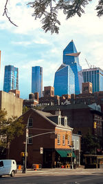 Modern buildings in city against sky