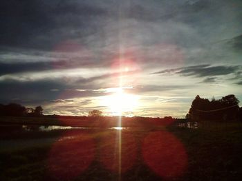 Scenic view of landscape against cloudy sky