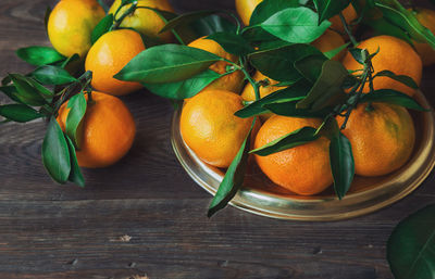 Fruits and leaves on table