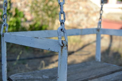 Close-up of swing chains at park