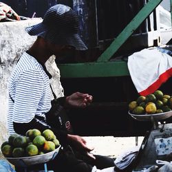 Man selling vegetables for sale at market stall