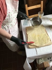 High angle view of woman preparing food on table