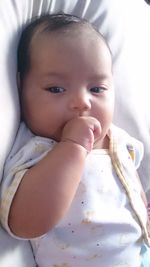 Close-up portrait of cute baby at home