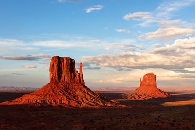 Dramatic sunset light on the mittens in monument valley, arizona