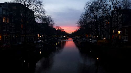 View of canal at sunset