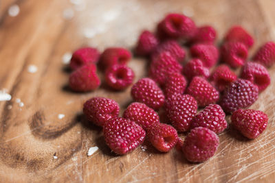 High angle view of fresh raspberry fruits on table