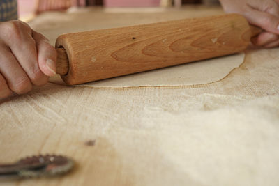 Close-up of person hand on cutting board