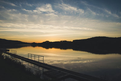 Scenic view of lake against sky during sunset