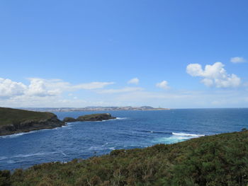 Scenic view of beach and sea against sky