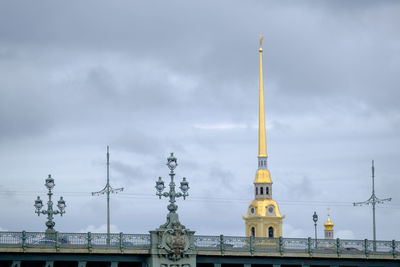 Low angle view of building against cloudy sky