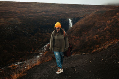 Full length of man walking on rock