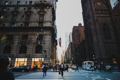 People walking on street in city