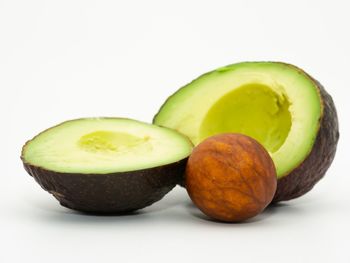 Close-up of fruits against white background