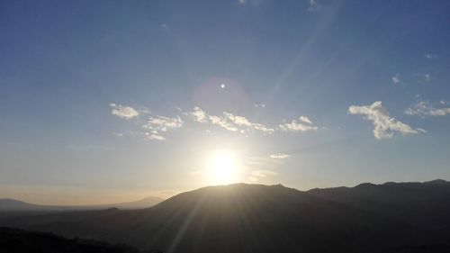 Scenic view of mountains against sky during sunset