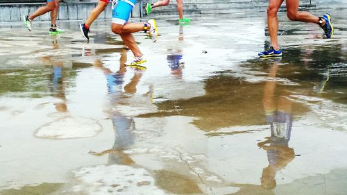 Reflection of people in water