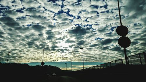 Low angle view of tower against sky during sunset