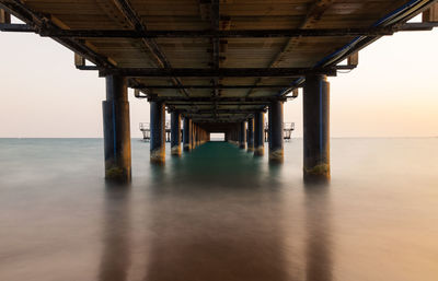 Pier over sea against sky