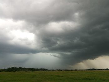 Scenic view of dramatic sky over landscape