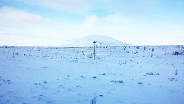 tranquil scene, tranquility, landscape, scenics, sky, beauty in nature, nature, winter, cold temperature, snow, non-urban scene, field, sand, day, blue, remote, beach, idyllic, fence, weather