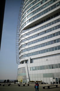 Low angle view of office building against sky