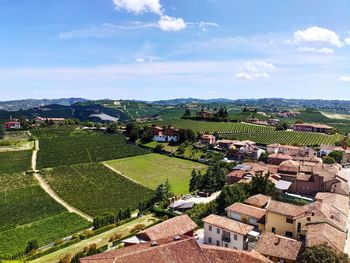 High angle view of townscape against hills and sky