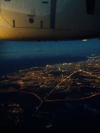 Aerial view of illuminated cityscape at night
