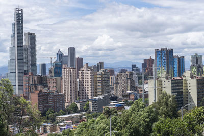 Buildings in city against sky