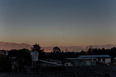 High angle view of buildings against sky during sunset