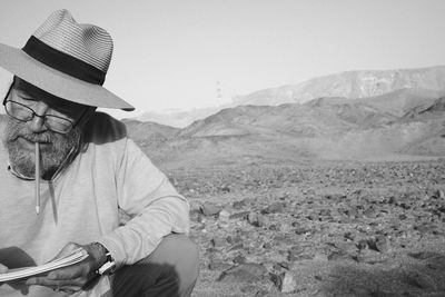 Rear view of man standing on mountain