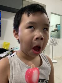 Close-up portrait of boy at home