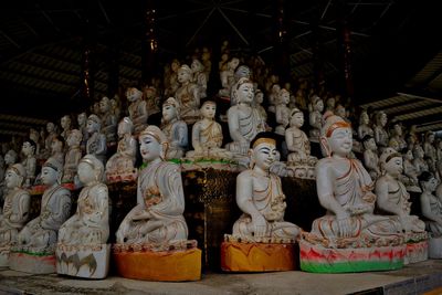 Statue outside temple against building