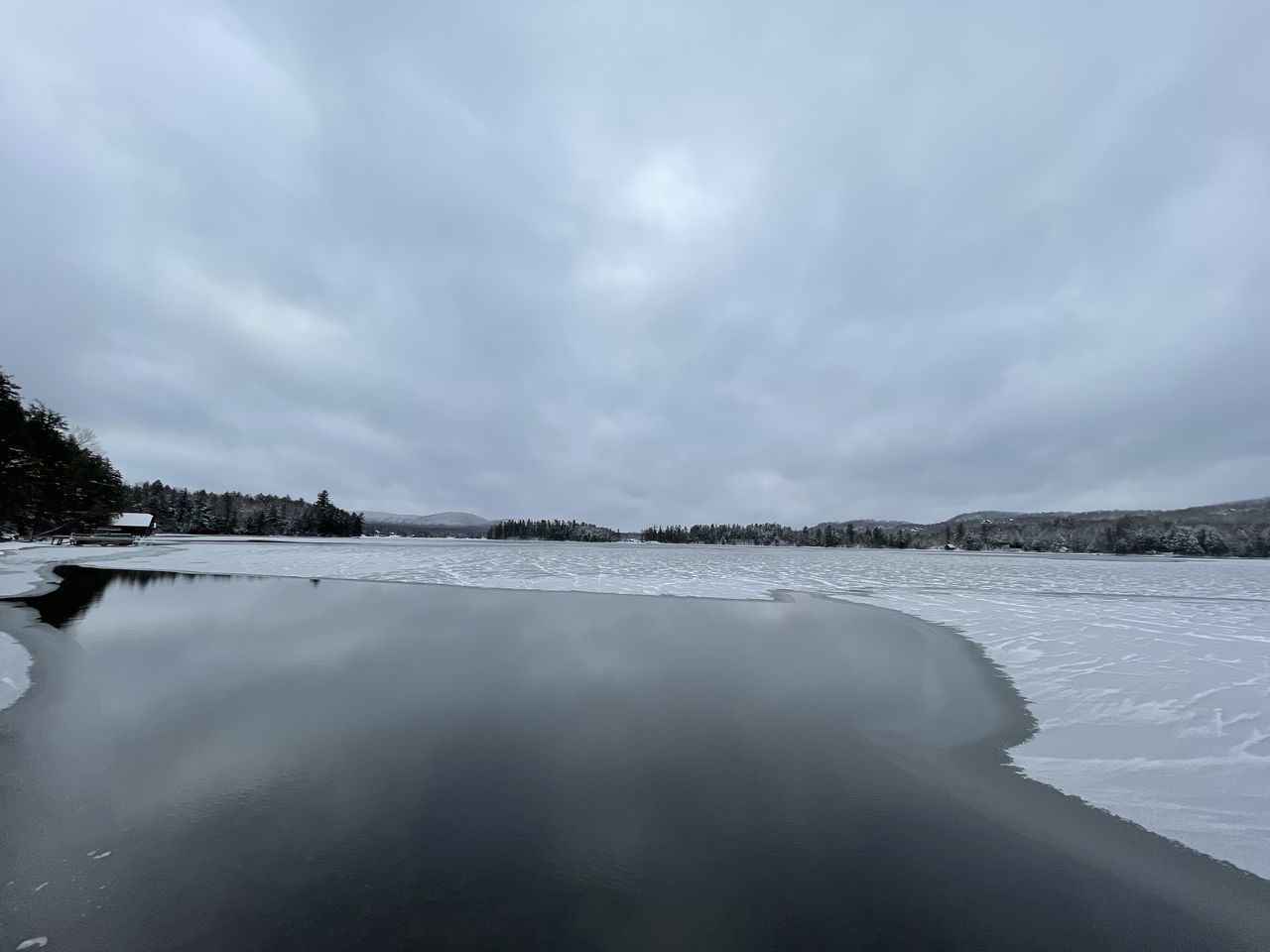 SCENIC VIEW OF LAKE BY SNOW AGAINST SKY