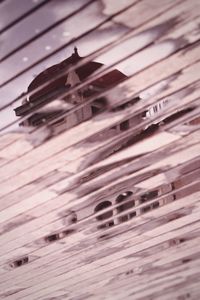 High angle view of piano keys on wooden table